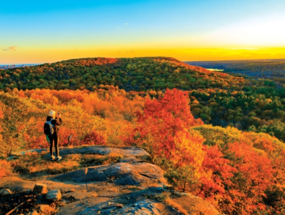 Woman overlooking Sleeping Giant State Park during Fall