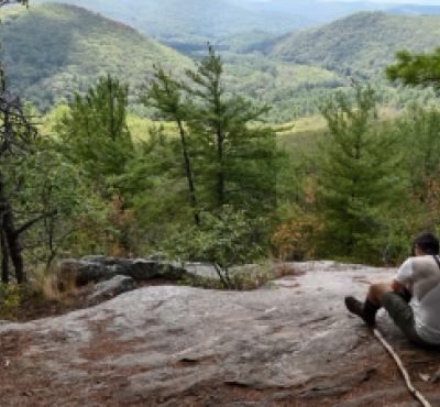Man overlooking hiking the Pine Loop Trail at Housatonic Meadows State Park