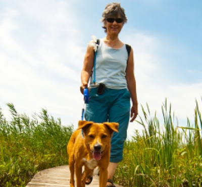 Woman walking dog at White Memorial